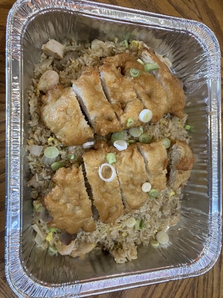 Crispy chicken over fried rice